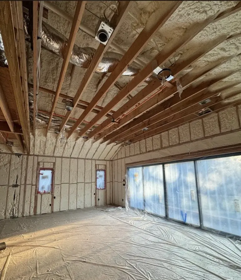 Interior walls and ceiling insulated with spray foam during new construction in Bellflower